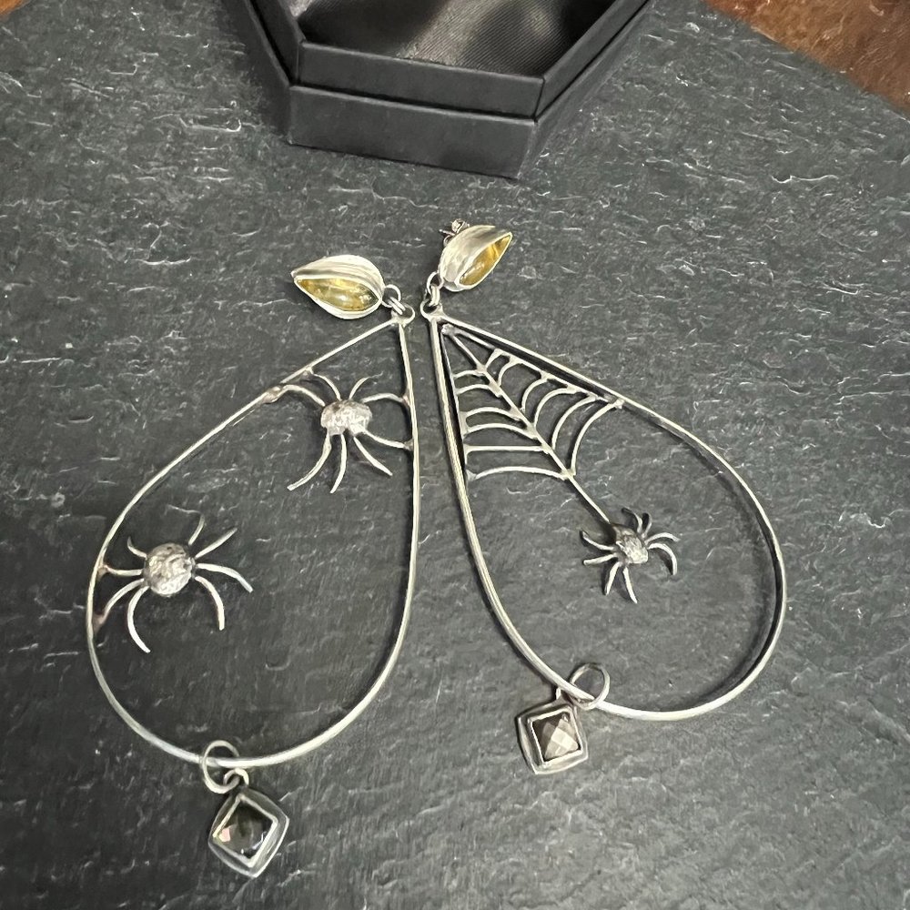 Sterling Silver spider hoops featuring golden amber and flashy pyrite
